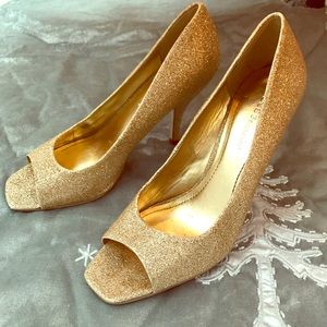 BCBG gold sparkle peep-toe pumps